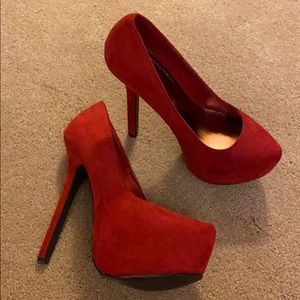 Red suede platform pumps